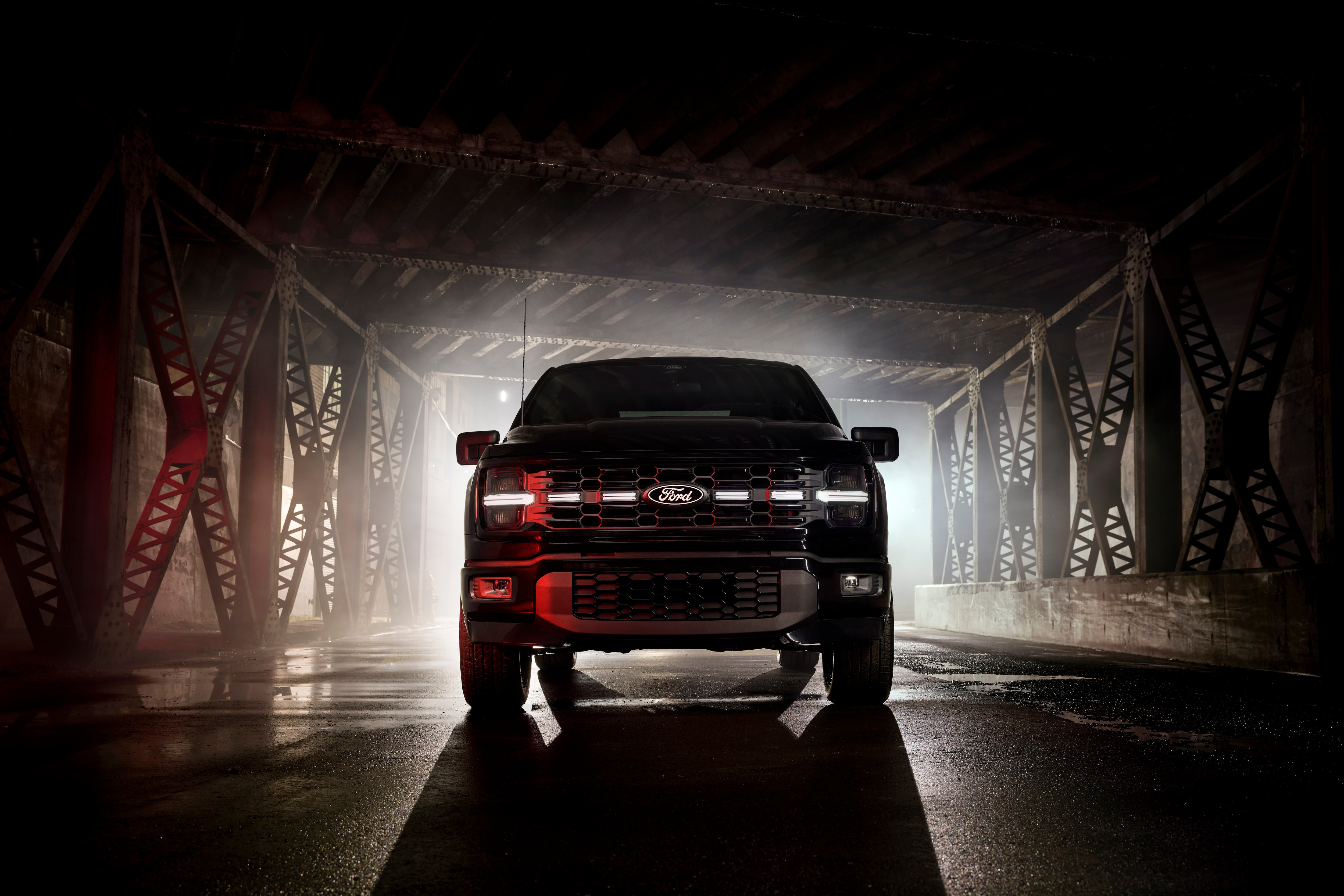 Front-end shot of illuminated grill of 2025 Ford F150 Lobo